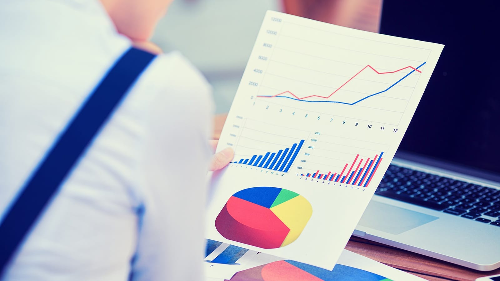 person looking at data report