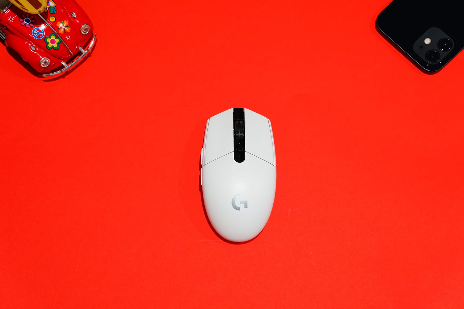 a computer mouse on a red background