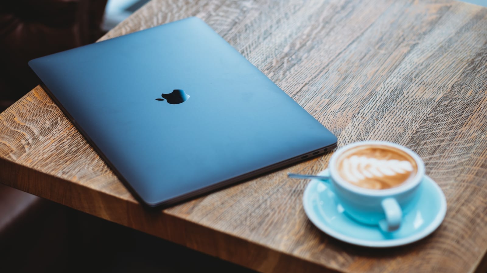 Laptop on table with coffee