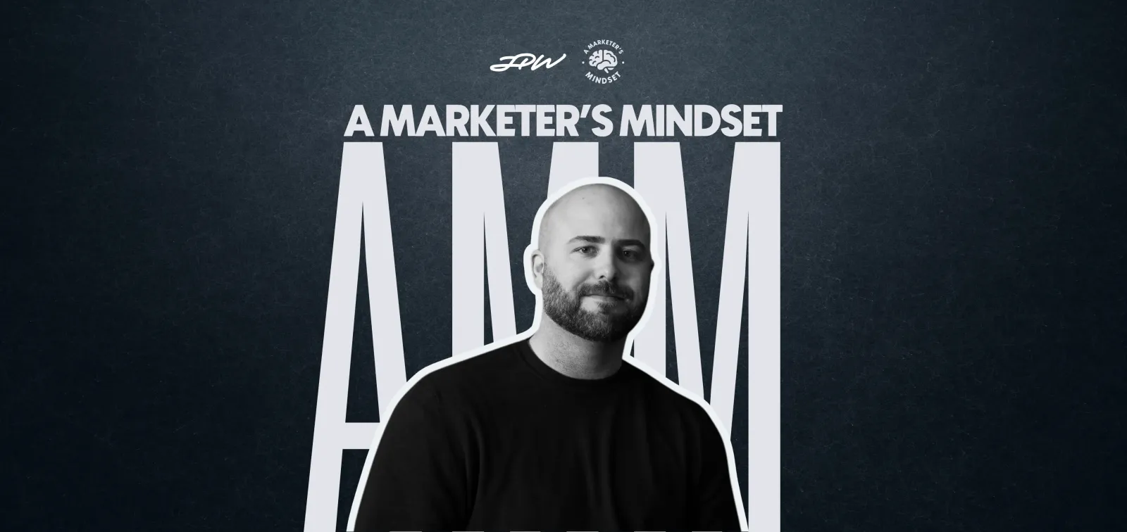 Man with a beard in front of large text "AMM" and the title "A Marketer's Mindset" on a dark background.