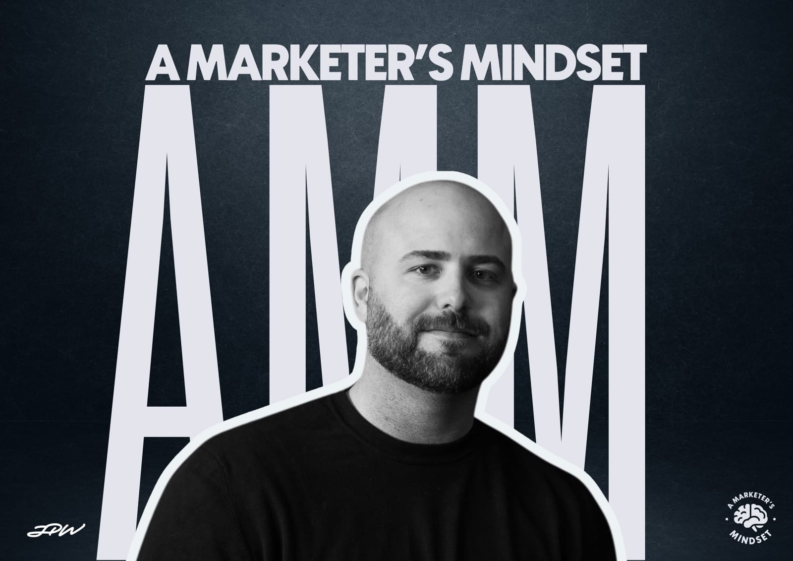 A man with a bald head and beard is smiling slightly, standing in front of large letters "AMM" and the text "A Marketer's Mindset" on a dark background.