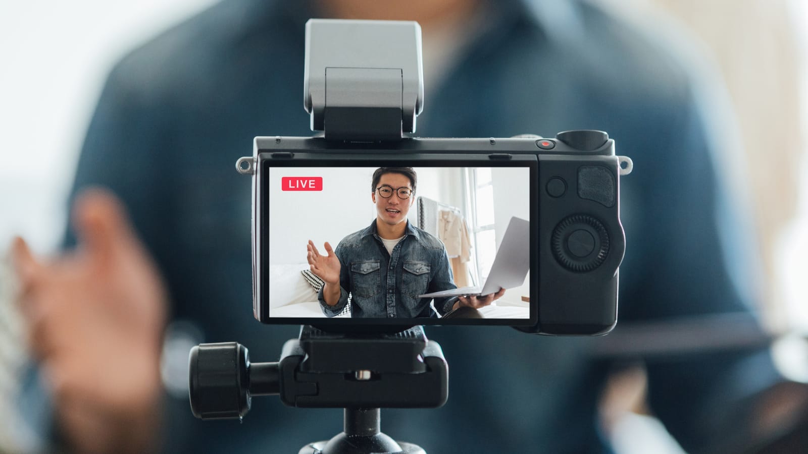 man speaking live into a camera