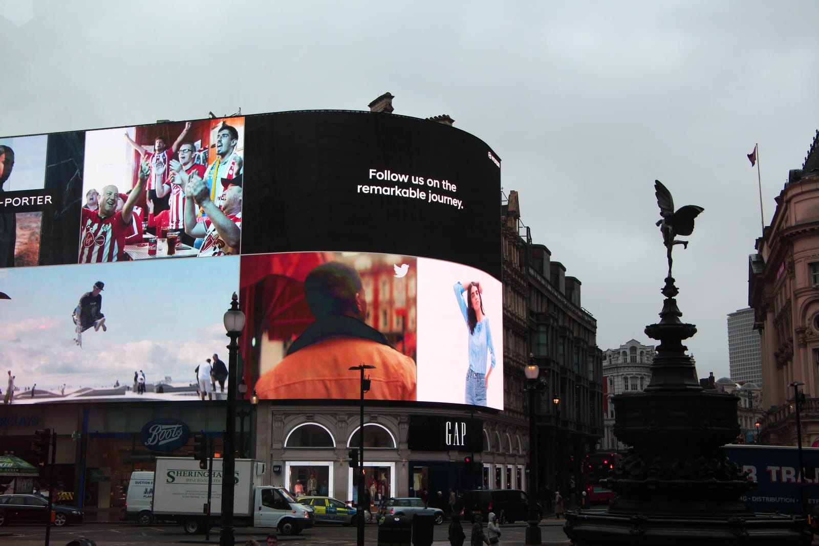 A large building with a lot of advertisements on it.